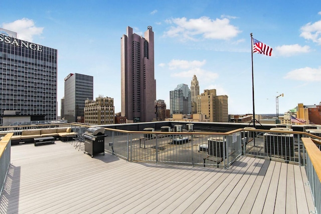 deck with a view of city and grilling area