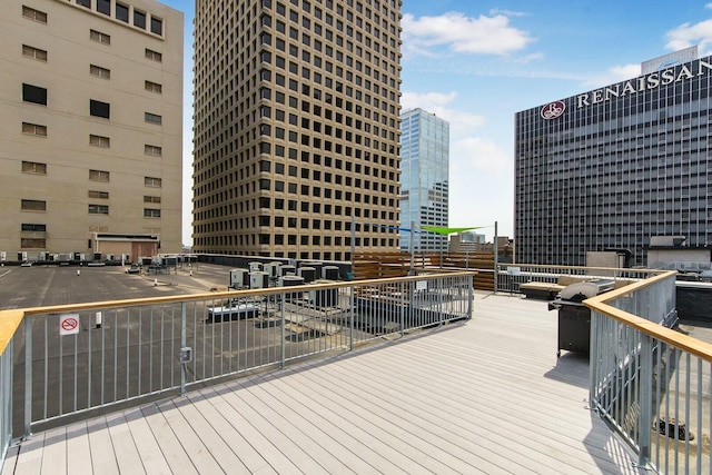 wooden terrace with a view of city