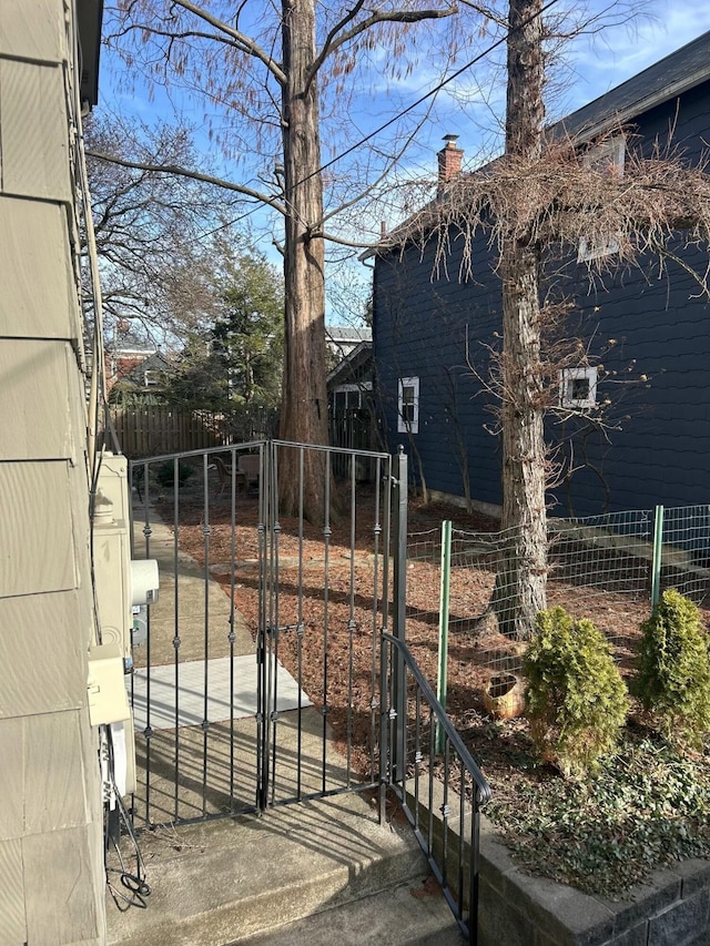 view of gate with fence