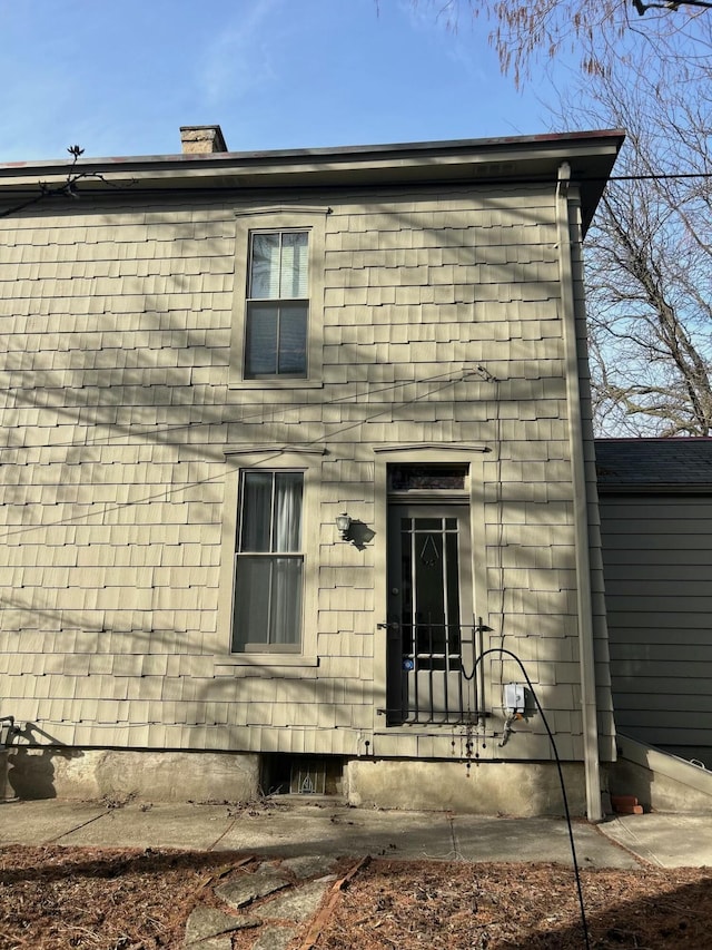 rear view of house with a chimney