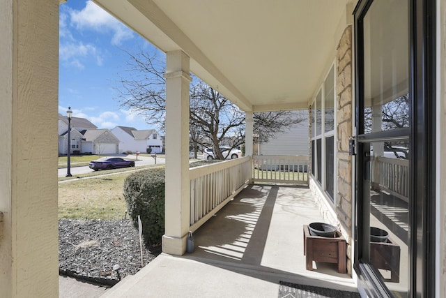 view of patio / terrace featuring a residential view and a porch