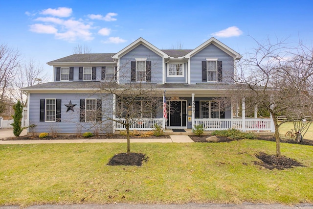 view of front of home with covered porch and a front lawn