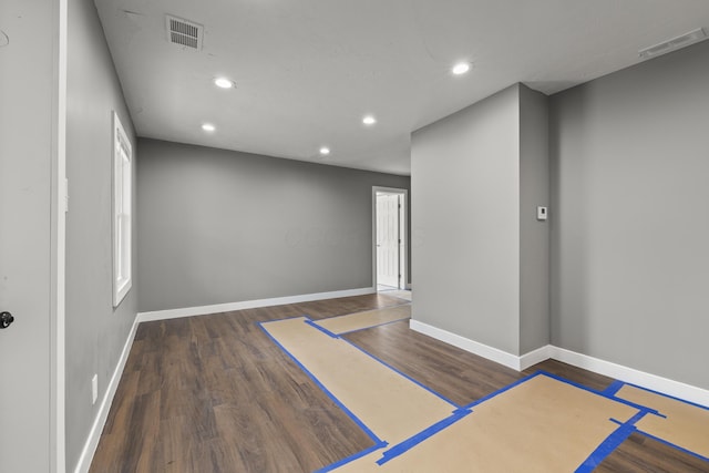 interior space with wood finished floors, visible vents, and recessed lighting