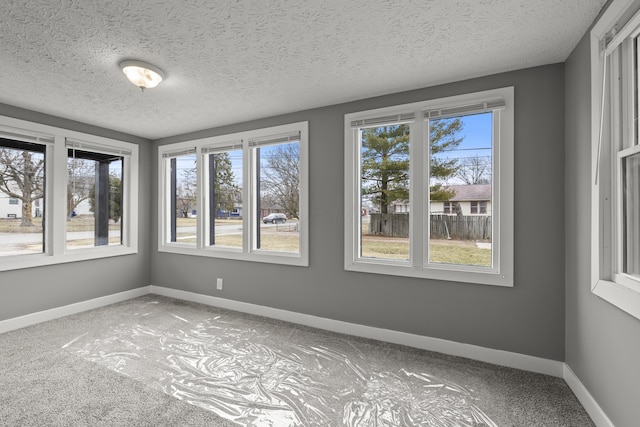 unfurnished sunroom featuring a healthy amount of sunlight