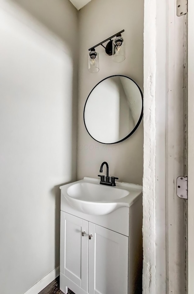 bathroom with vanity and baseboards