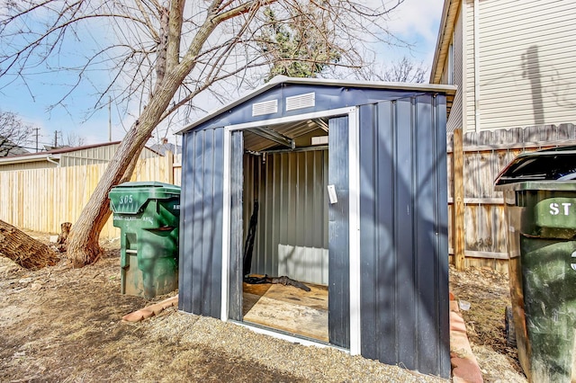 view of shed featuring a fenced backyard