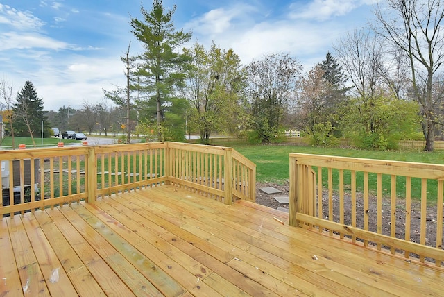 wooden deck with a yard