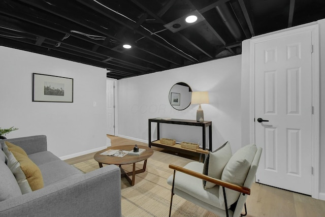 living room with wood finished floors and baseboards