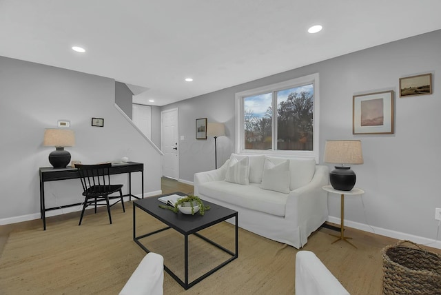 living room with recessed lighting and baseboards