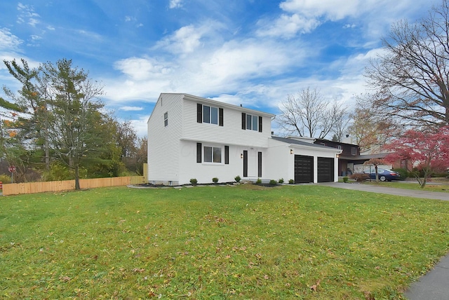 view of front of house with a garage, driveway, a front lawn, and fence