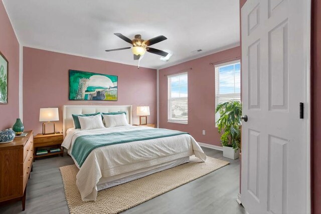 7429 Willow Leaf Dr, Canal Winchester, OH 43110 - bedroom featuring wood finished floors, ceiling fan, and baseboards