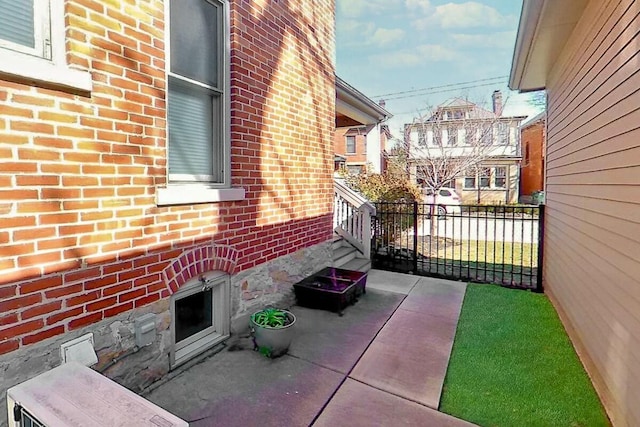 view of patio / terrace featuring fence