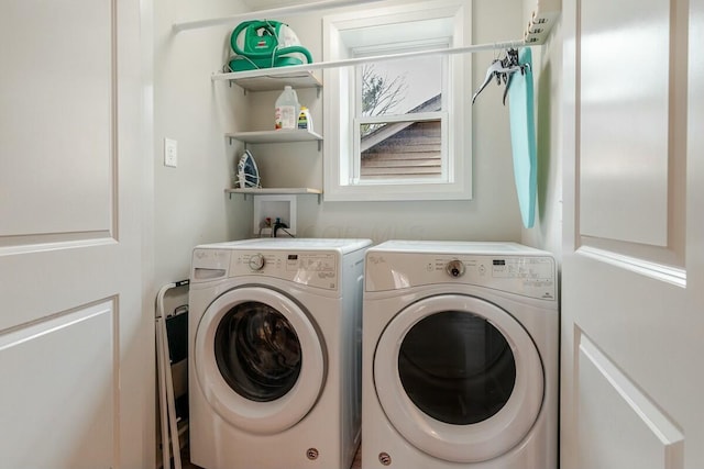 laundry area featuring washer and dryer and laundry area