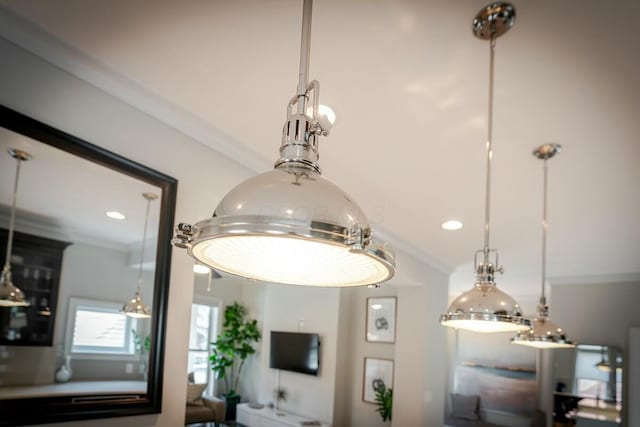 details featuring ornamental molding and recessed lighting