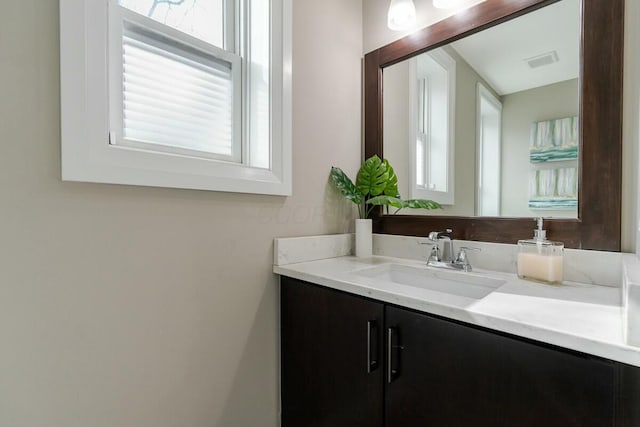 bathroom with visible vents and vanity