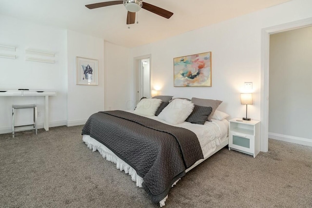 carpeted bedroom featuring a ceiling fan and baseboards