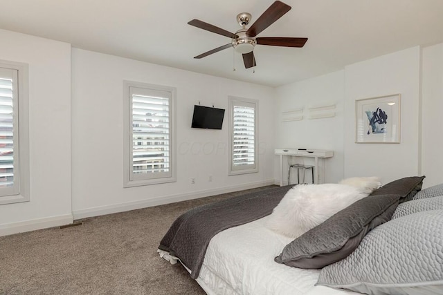 bedroom featuring a ceiling fan, carpet flooring, and baseboards