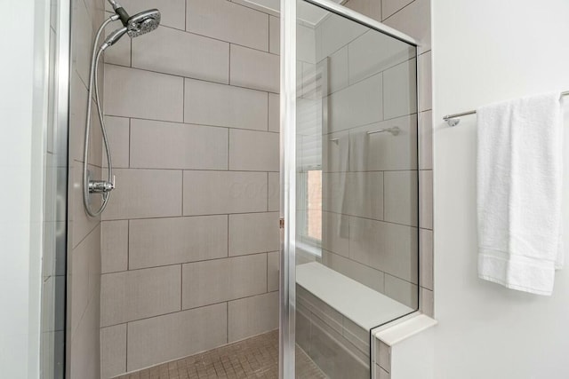 bathroom with a shower stall