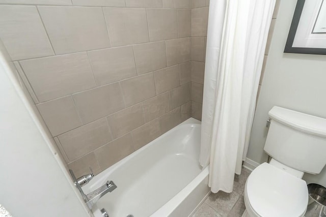 bathroom with shower / tub combo with curtain and toilet