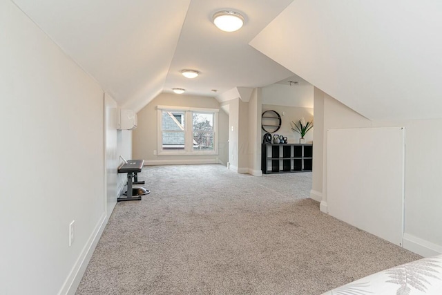 bonus room featuring vaulted ceiling, carpet, and baseboards