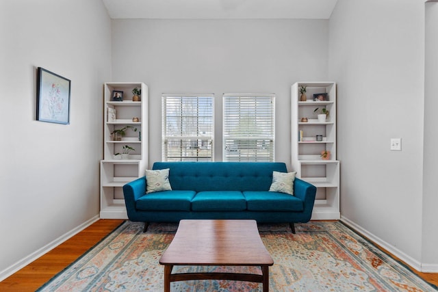 living room featuring wood finished floors and baseboards