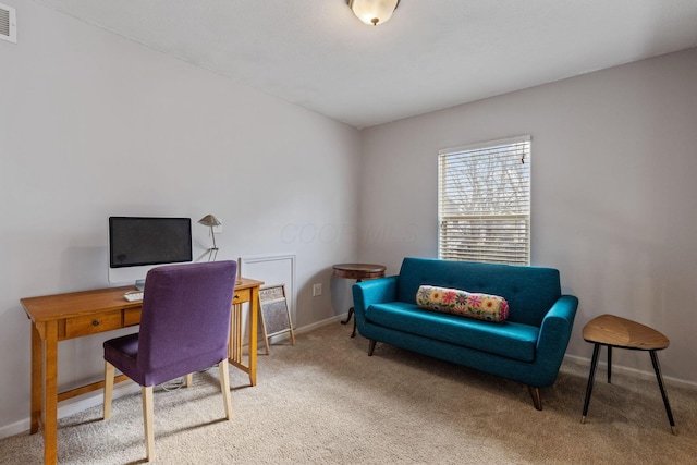 carpeted home office featuring baseboards