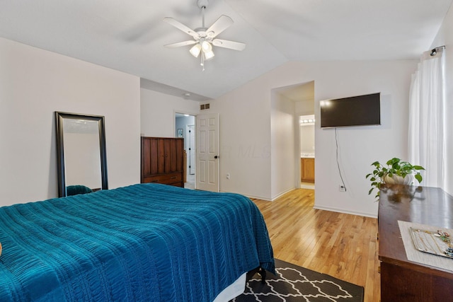 bedroom featuring visible vents, vaulted ceiling, light wood finished floors, and ceiling fan