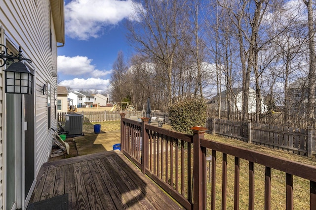 wooden terrace featuring cooling unit, a patio area, a fenced backyard, and a residential view