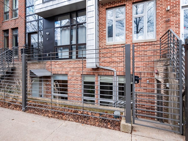 view of side of property featuring brick siding