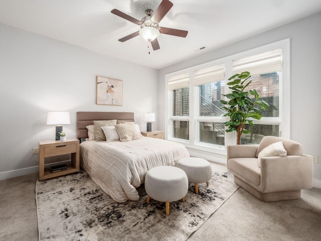 bedroom featuring carpet floors, visible vents, baseboards, and a ceiling fan