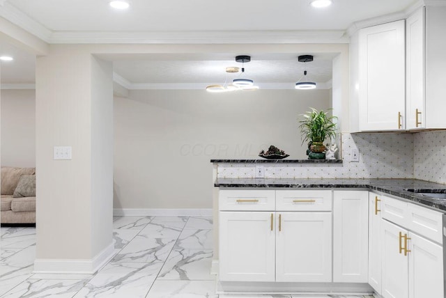 kitchen featuring dark stone counters, tasteful backsplash, ornamental molding, and baseboards