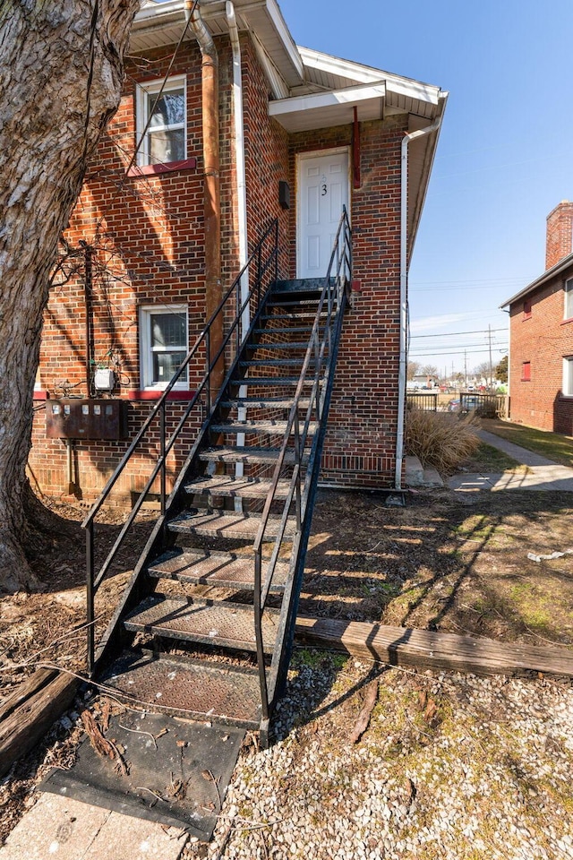 view of front of house featuring brick siding