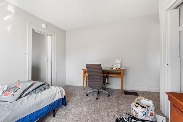 carpeted bedroom featuring baseboards