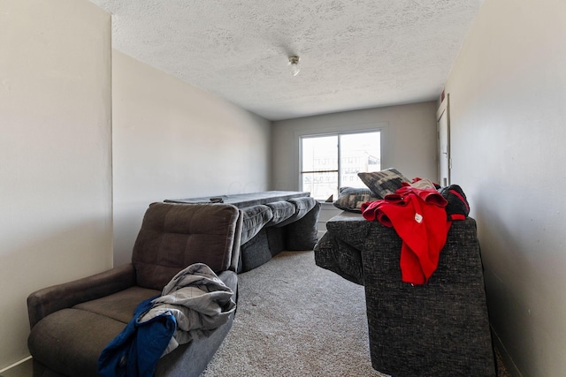 carpeted bedroom featuring a textured ceiling