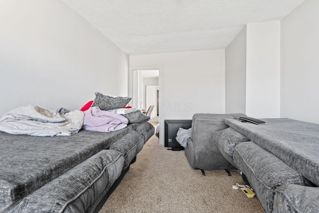 carpeted bedroom with a textured ceiling