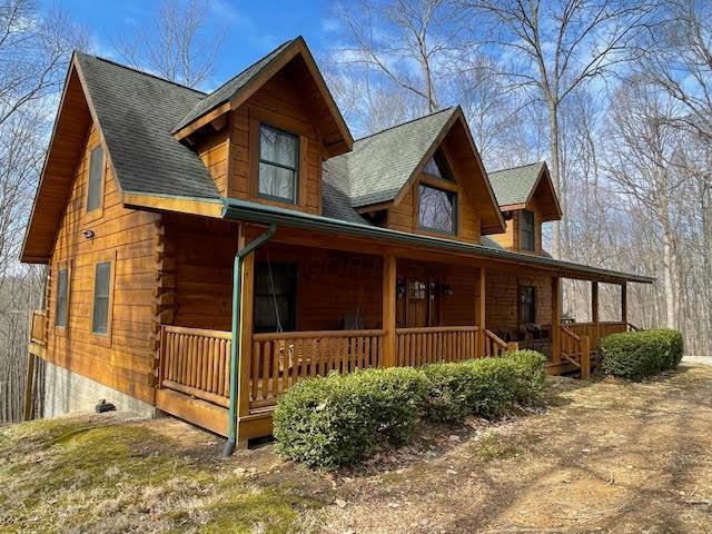 view of front of house featuring covered porch and roof with shingles