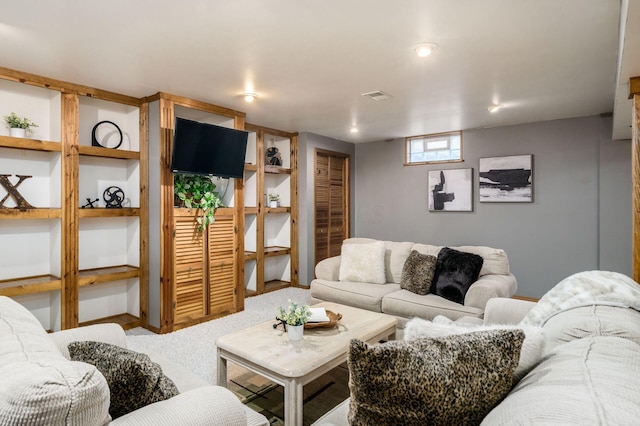 living room featuring visible vents and carpet