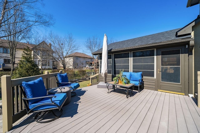 wooden terrace featuring an outdoor hangout area