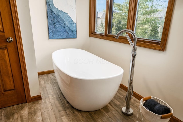 interior details featuring baseboards and wood finished floors