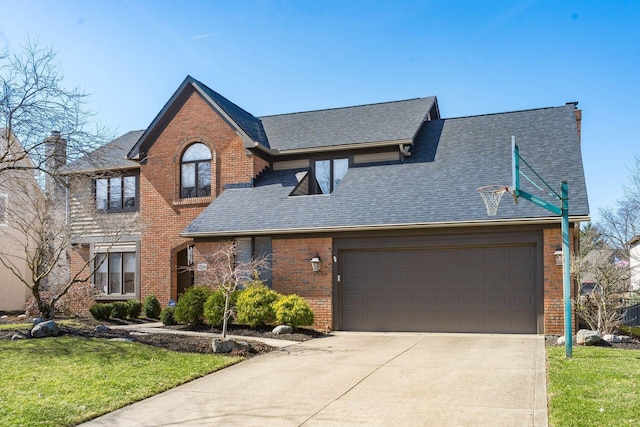 traditional home with a front lawn, driveway, an attached garage, a shingled roof, and brick siding