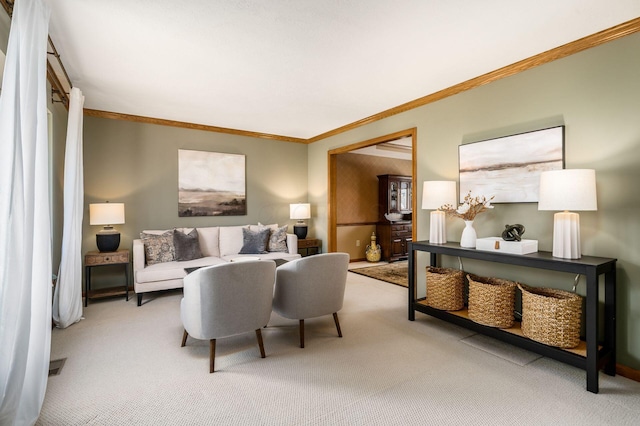 carpeted living area featuring ornamental molding