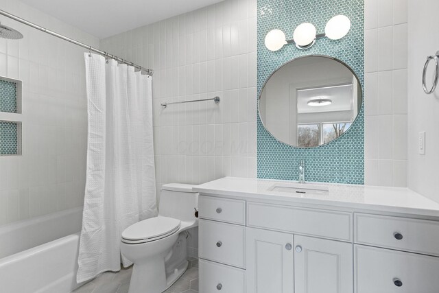 bathroom with vanity, shower / bathtub combination with curtain, tile patterned flooring, tile walls, and toilet