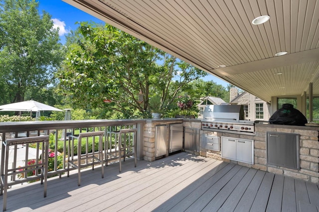 wooden terrace with grilling area and area for grilling