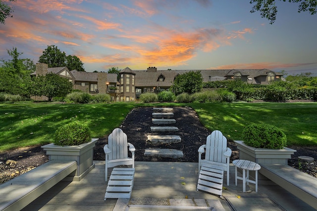 patio terrace at dusk with a yard