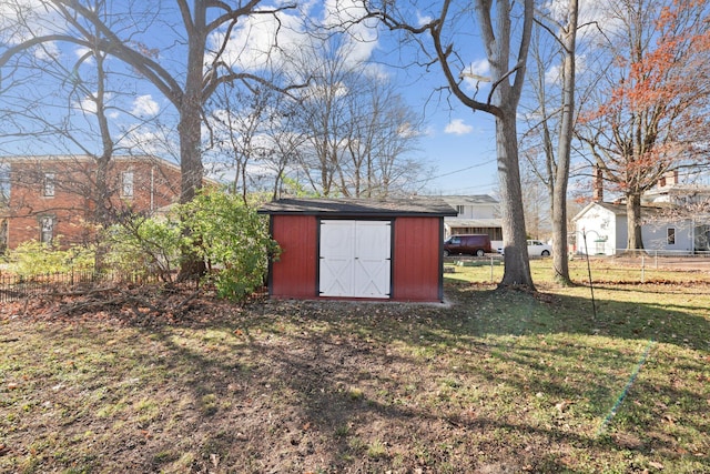 view of shed with fence