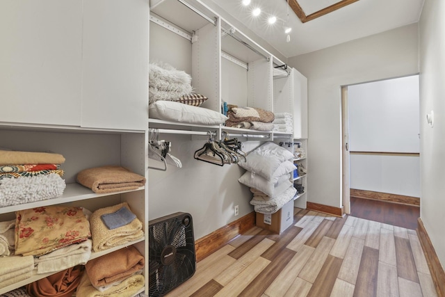 spacious closet featuring wood finished floors