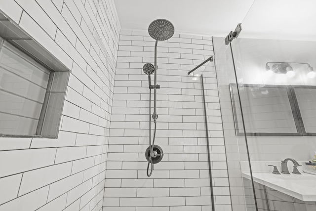 full bathroom with tiled shower