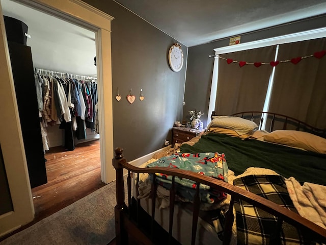 bedroom with wood finished floors