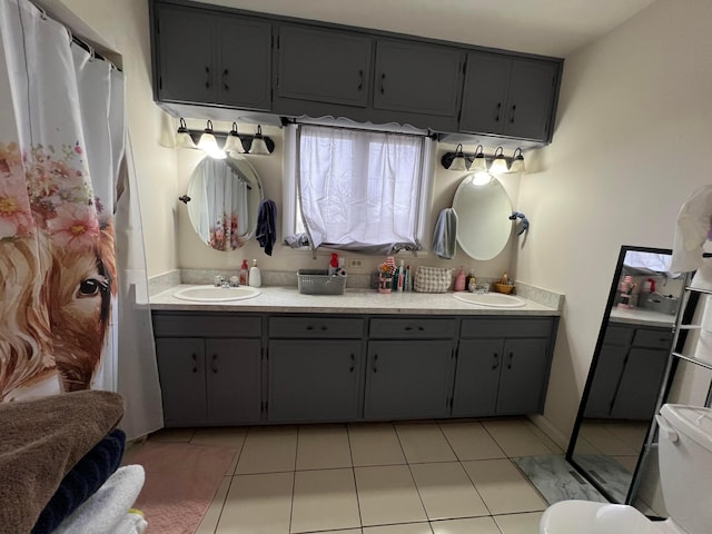 full bathroom with double vanity, tile patterned flooring, a sink, and a shower with shower curtain