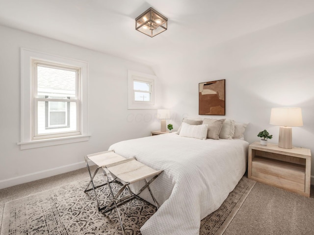 bedroom with carpet and baseboards